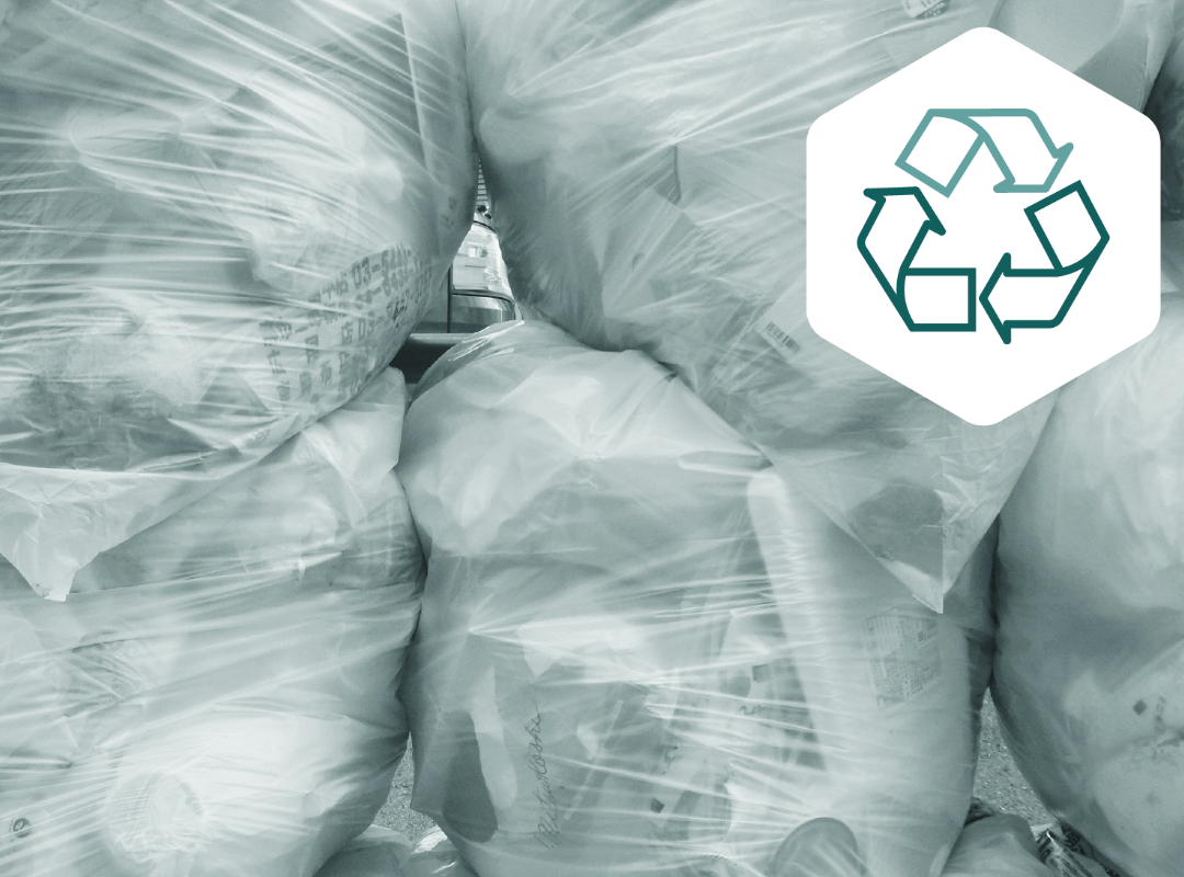 Plastic waste bags with recycling symbol – illustrating packaging waste reduction under the EU PPWR regulation