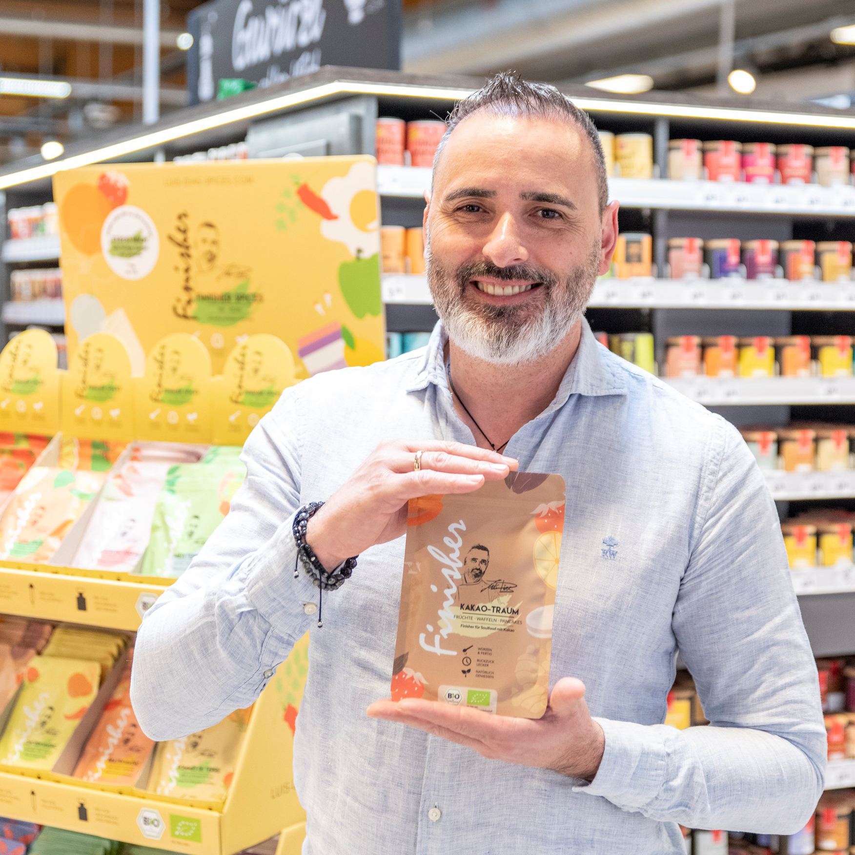 Spice packaging as a stand-up pouch held by Luis Dias